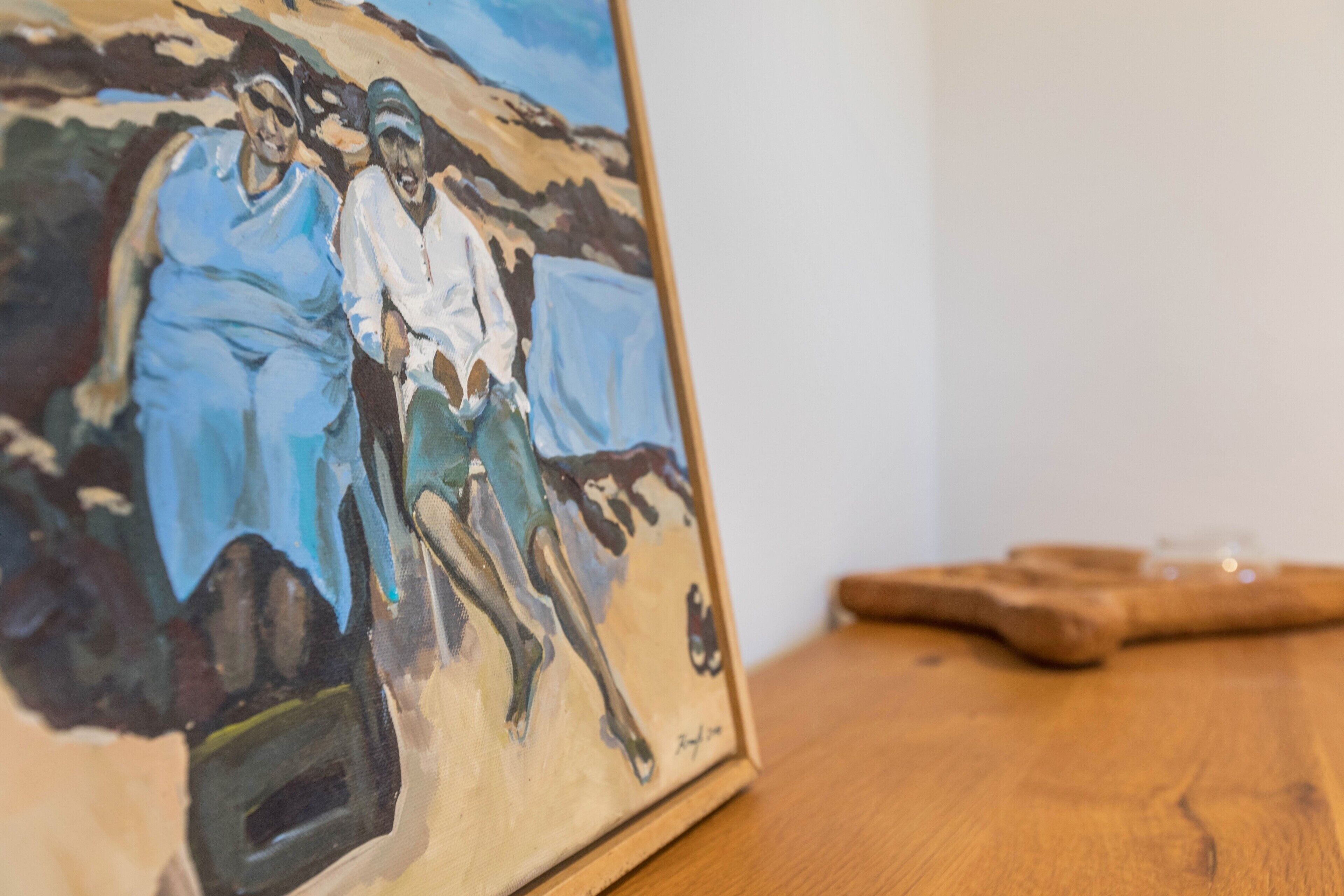 A painting on a wooden table.