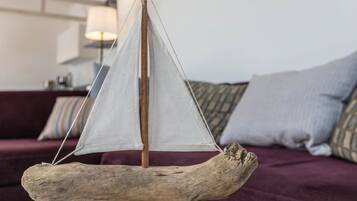 A model sailboat on a wooden base.