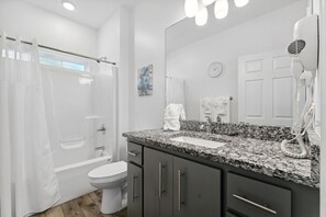 Hair dryer, towels, soap, toilet paper