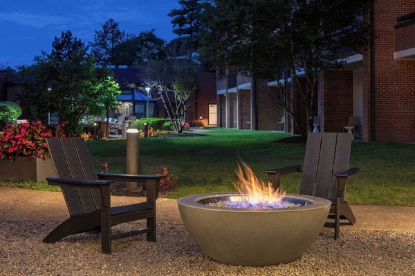 Unwind by the glowing fire pit after a busy day.