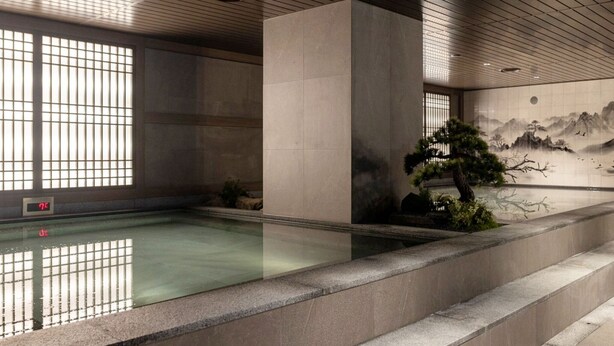 A serene indoor pool area with a traditional mural, a bonsai tree, and a digital clock. - Anook Signature Hotel Incheon Guwol (Incheon)