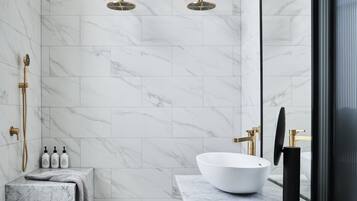 Deluxe Room, 1 King Bed | Bathroom | Deep-soaking bathtub, hair dryer, bathrobes, towels