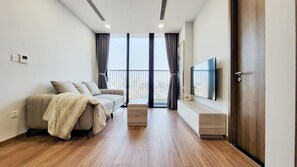 Deluxe H1623 | Living area | 55-inch Smart TV with digital channels, TV - ecogreen saigon (Ho Chi Minh City)