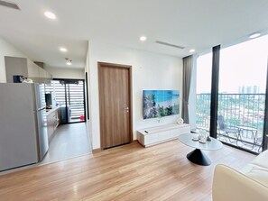 Signature Apartment, 2 Bedrooms, City View | Living area | 55-inch Smart TV with digital channels, TV