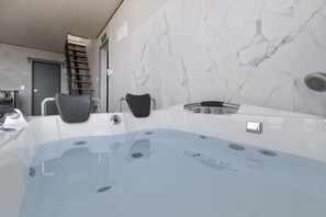 Deluxe Room - Room 101, Room 102 randomly assigned (spa bath available once a day)
