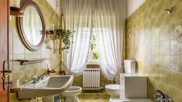 Bathtub, hair dryer, towels