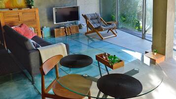 Basic Cottage, 1 Bedroom, River View, Garden Area | Living area | 100-inch TV with digital channels