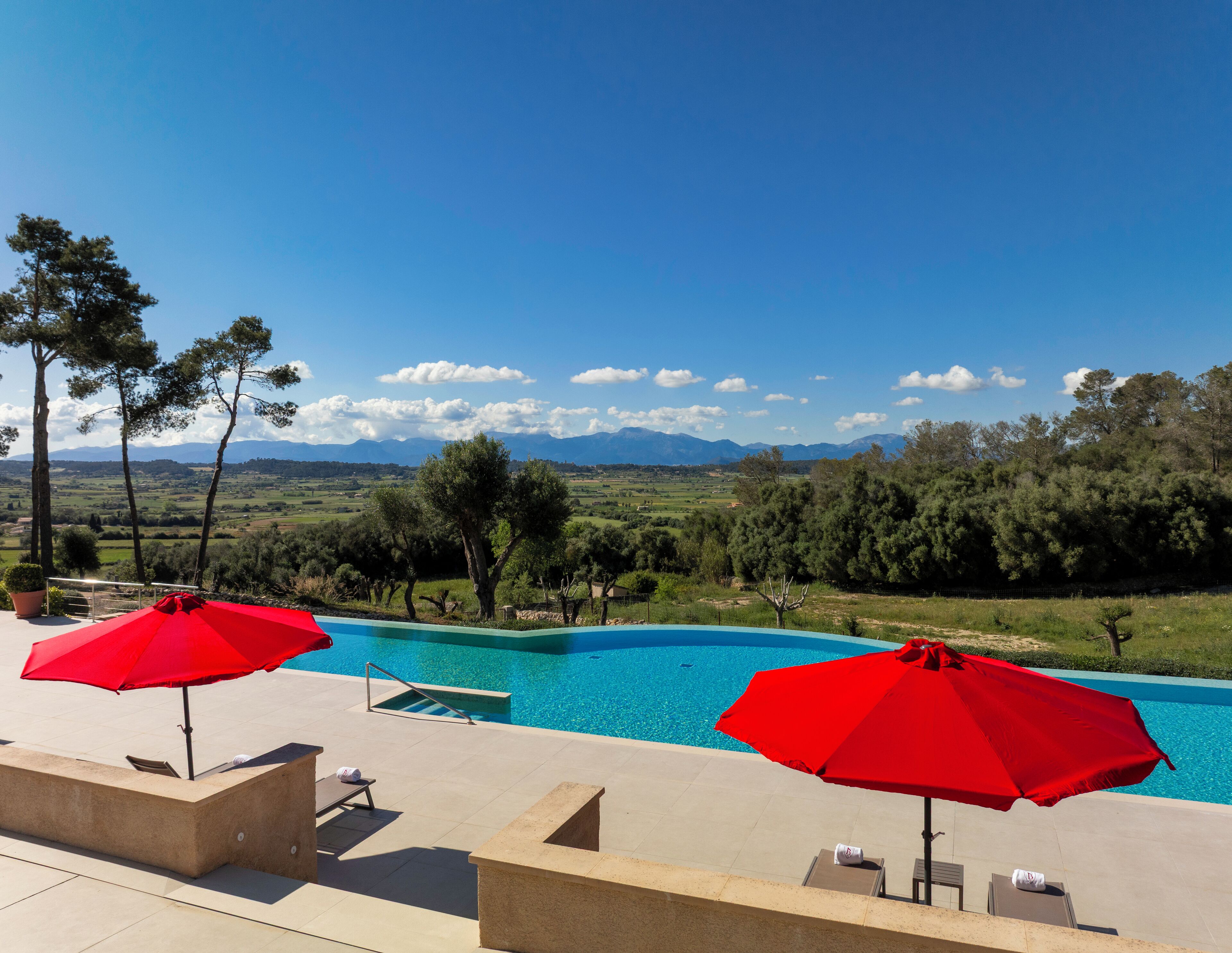 Indoor pool, outdoor pool, pool umbrellas, pool loungers