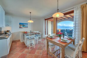 Family Apartment, Multiple Bedrooms, 2 Bathrooms, Mountainside (Borgo Belvedere-lake view & shared) | Dining