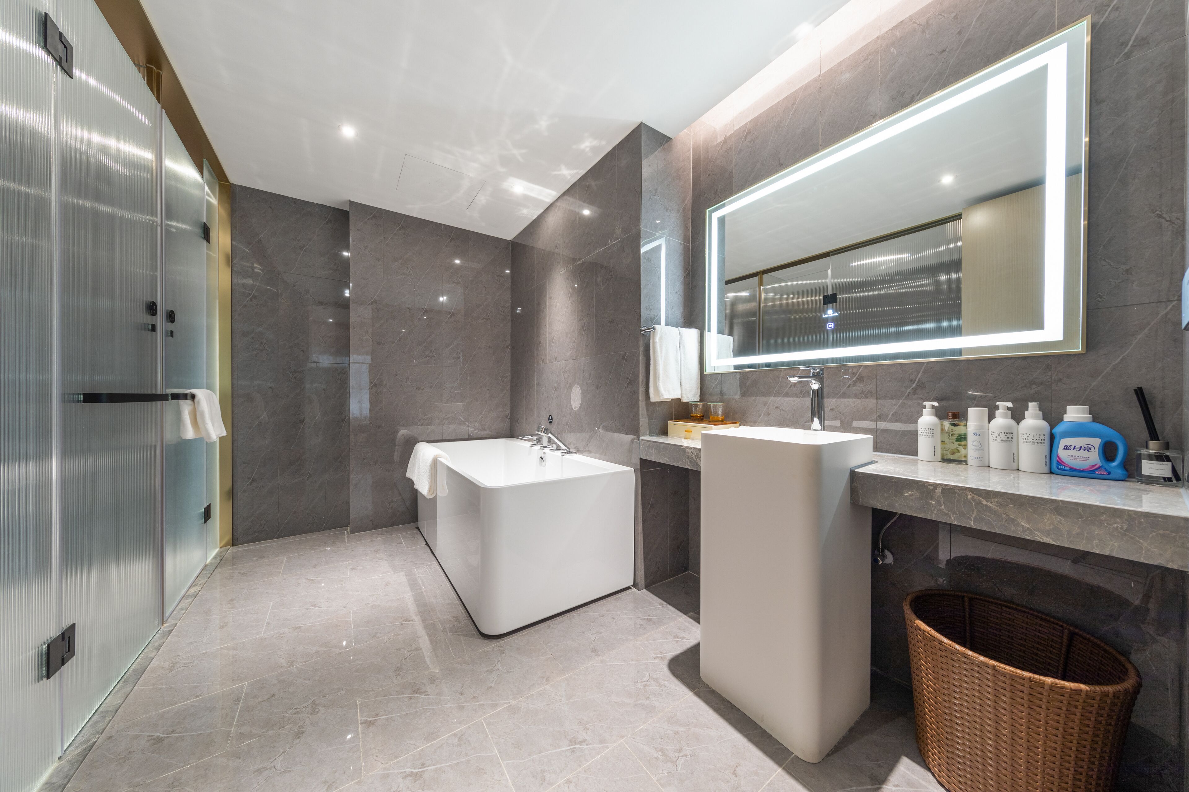 premier suite, 1 queen bed | bathroom | designer toiletries, hair dryer, bathrobes, slippers