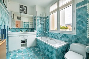 Bathtub, hair dryer, towels