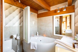 Bathroom features a bathtub, sink, and toilet.