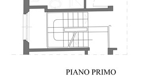 A floor plan of a hotel room labeled "PIANO PRIMO" with a kitchen area, a dining table, and a bathroom. - Studio Apartment B4 (Modena)