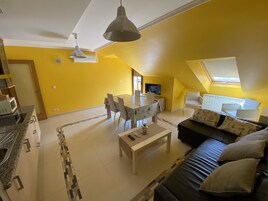 Apartamento Deluxe | Zona de estar