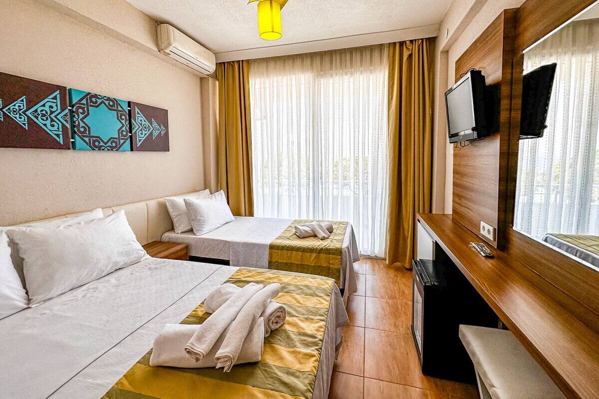 Deluxe Triple Room, Sea View | Iron/ironing board, free WiFi, bed sheets
