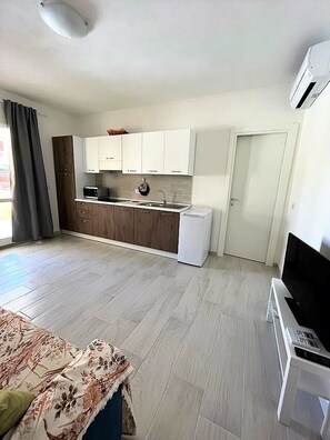 Fridge, microwave, stovetop, coffee/tea maker