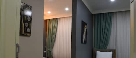 Minibar, desk, laptop workspace, iron/ironing board