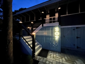 Stylish entrance with a staircase and covered porch area.