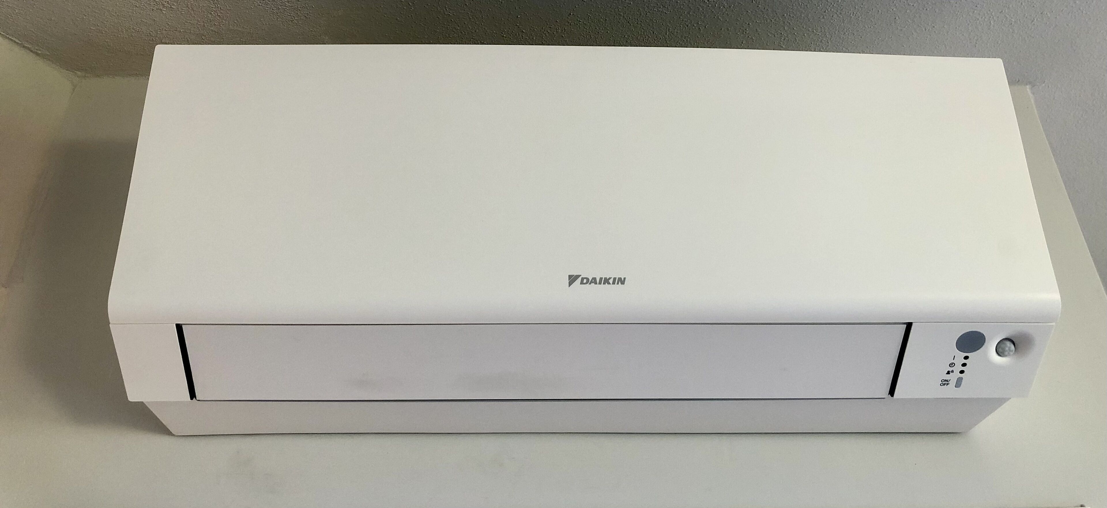 A white, rectangular device with the brand name 'DAIKIN' on the top.