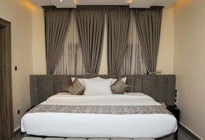 Executive appartement | Een minibar, individueel gedecoreerd, individueel gemeubileerd