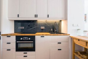 Fridge, microwave, stovetop, coffee/tea maker
