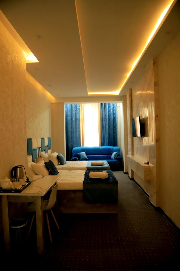 Pillow-top beds, desk, blackout curtains, soundproofing