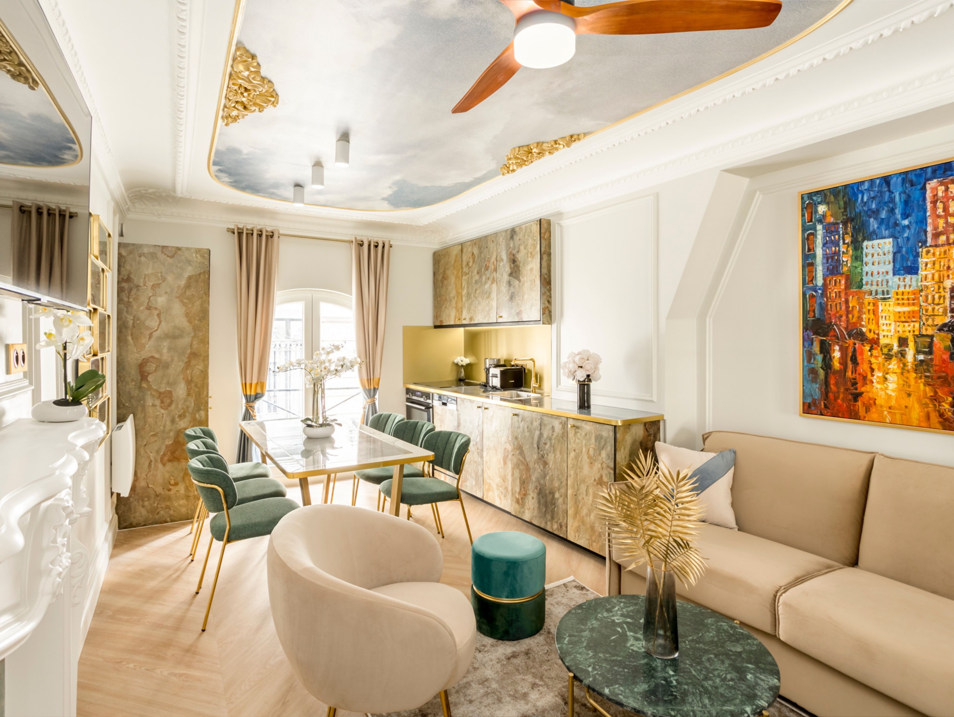 A modern living room with a dining area, a kitchen, and a large cityscape painting.