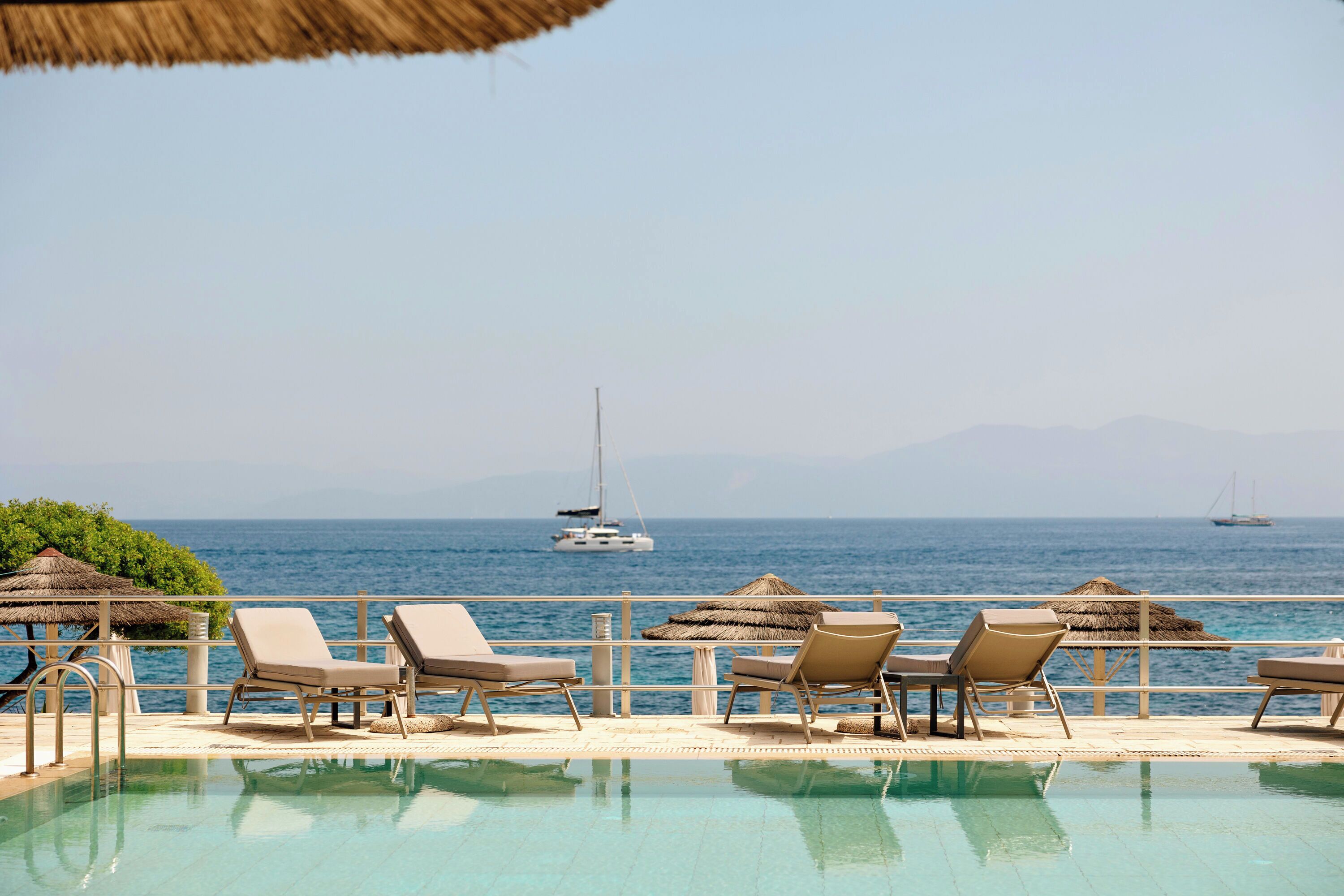 Outdoor pool, pool umbrellas, sun loungers