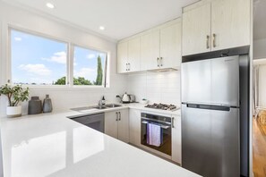 Fridge, microwave, oven, stovetop - 3/4 Beach Road, Castor Bay, Auckland 0620 (Auckland North Shore)