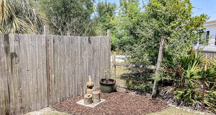Dog-friendly cottage near the beach with patio, grill, washer/dryer, partial AC