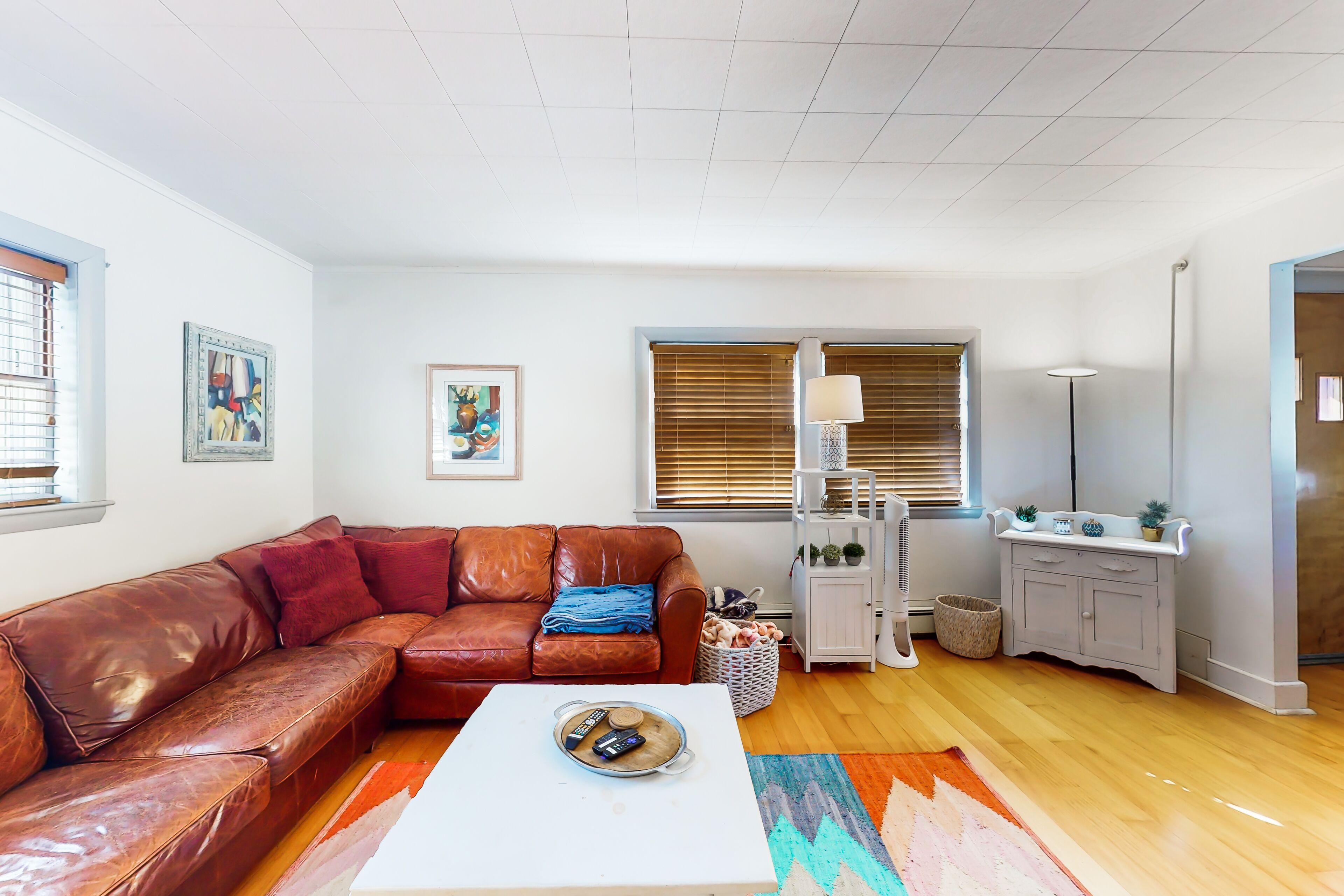 Historic hideaway near the water with a spacious deck, beach gear, & firepit