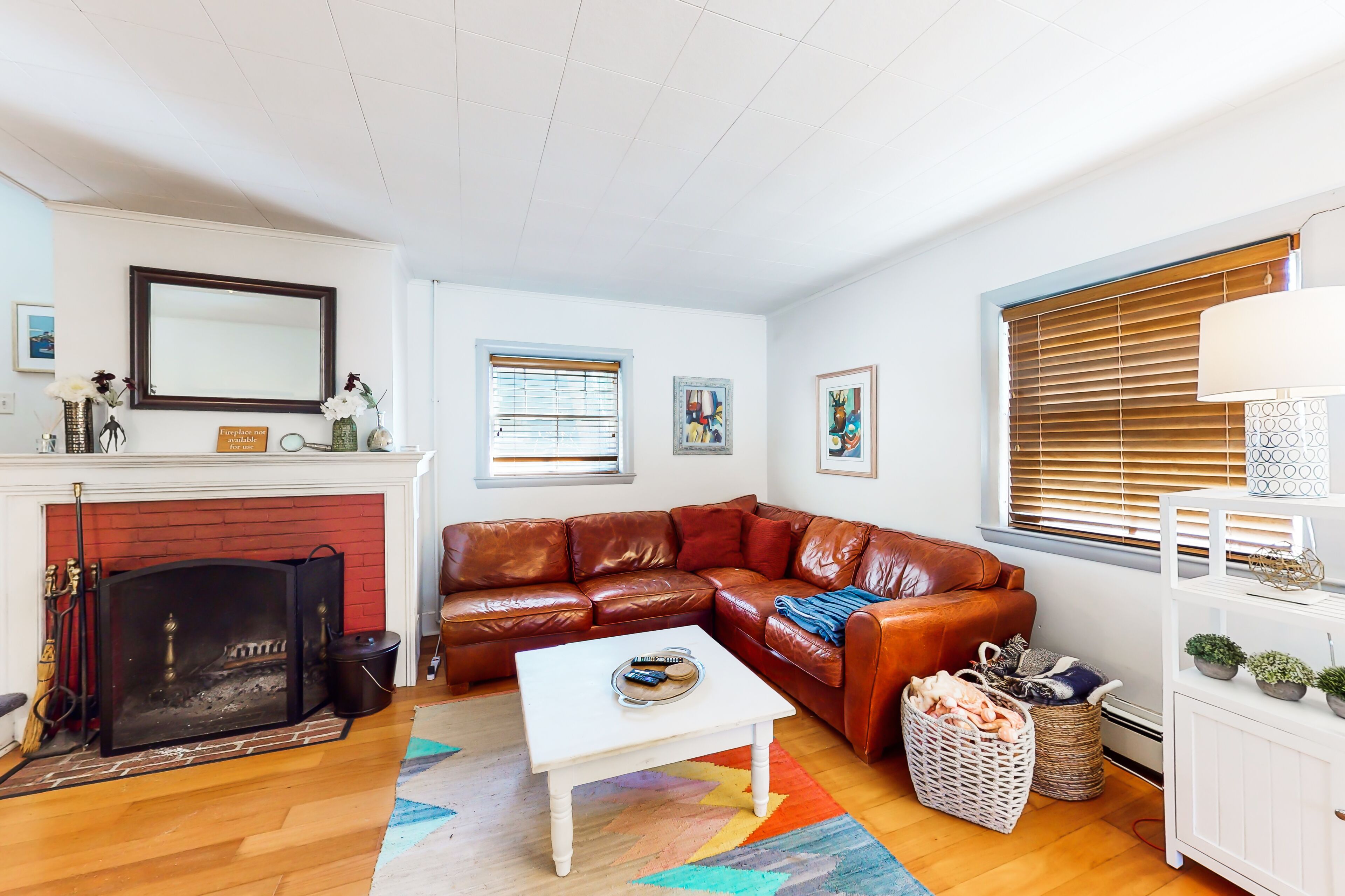 Historic hideaway near the water with a spacious deck, beach gear, & firepit