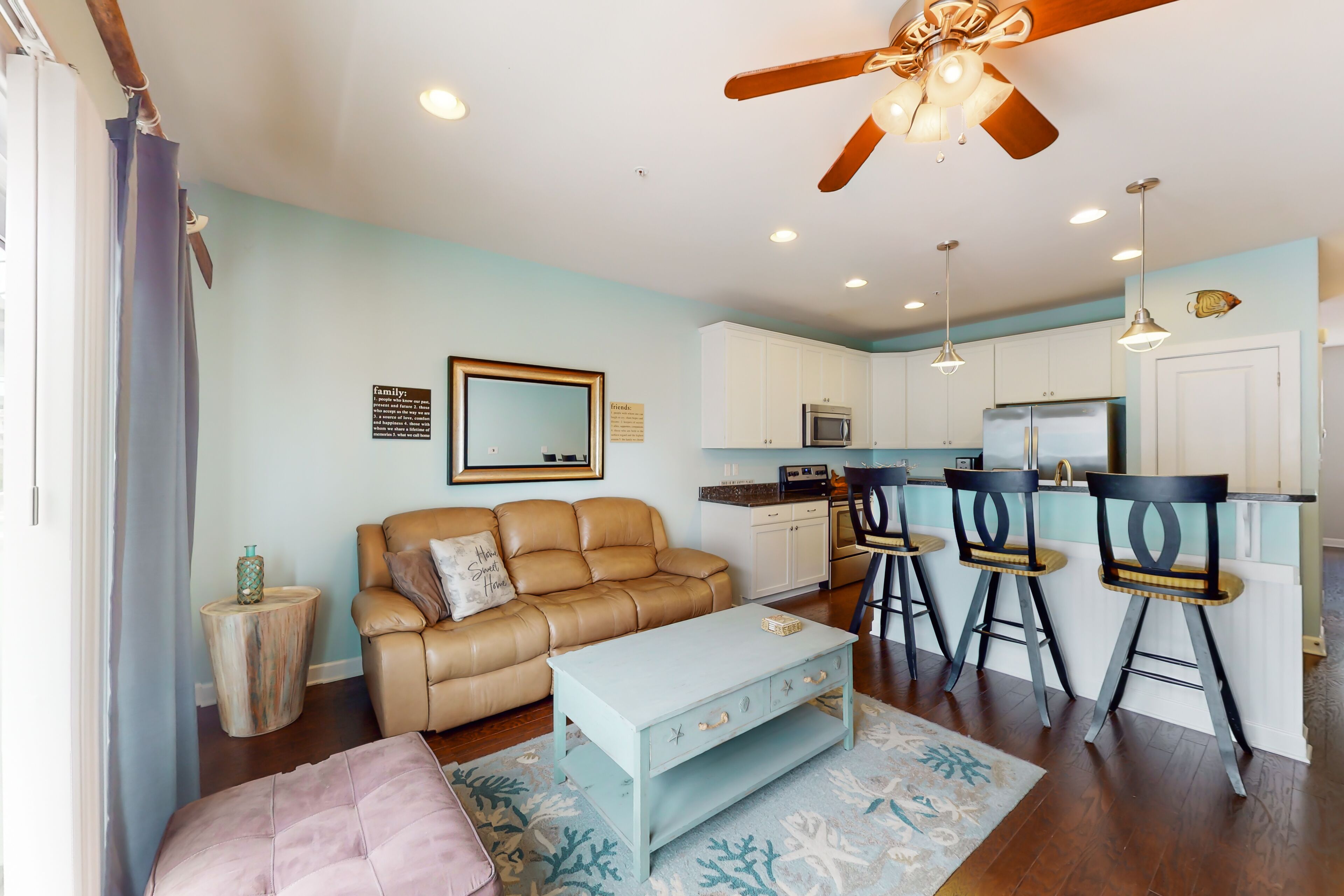 Coastal townhome near the beach with a boat slip, balcony, and pool access