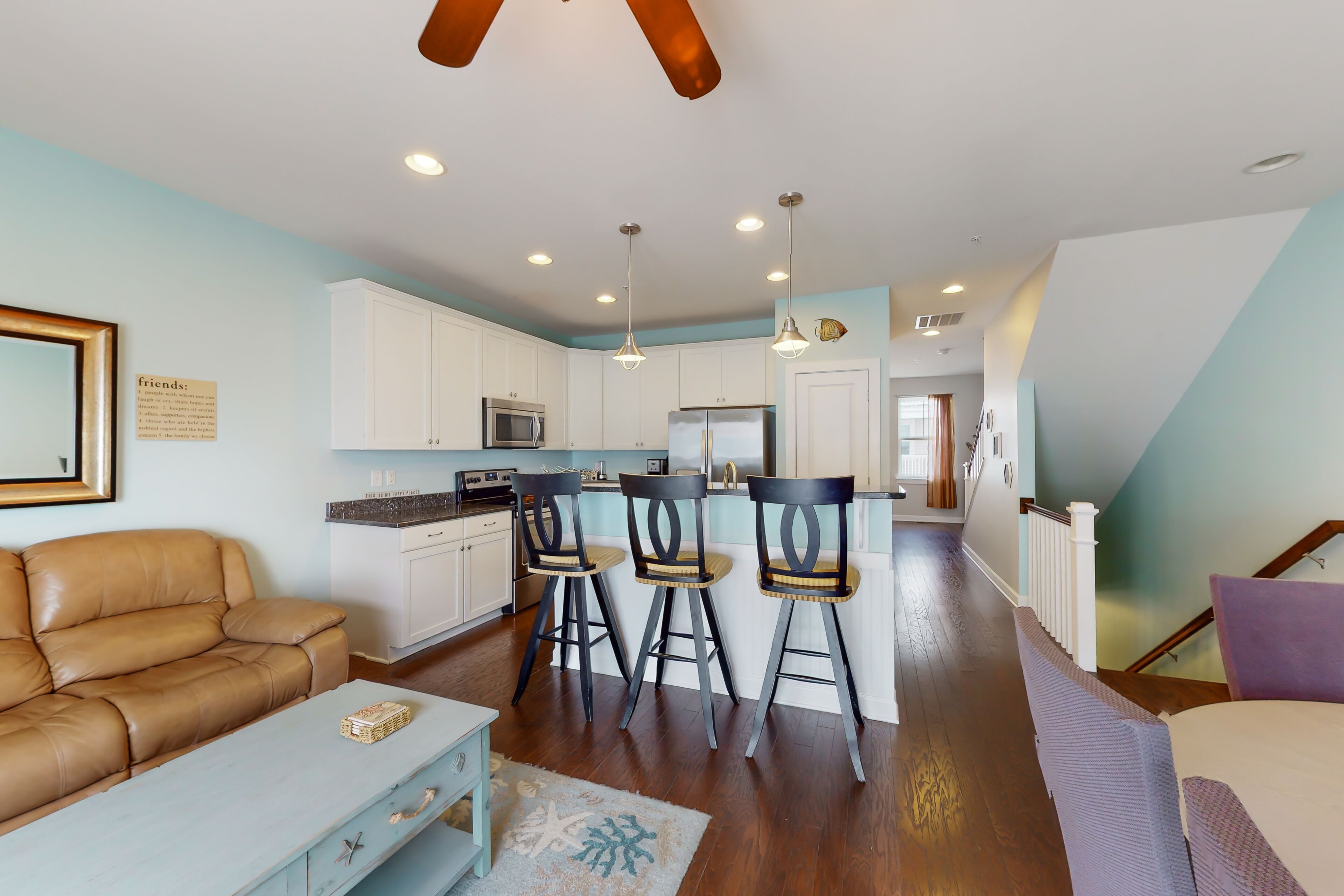 Coastal townhome near the beach with a boat slip, balcony, and pool access