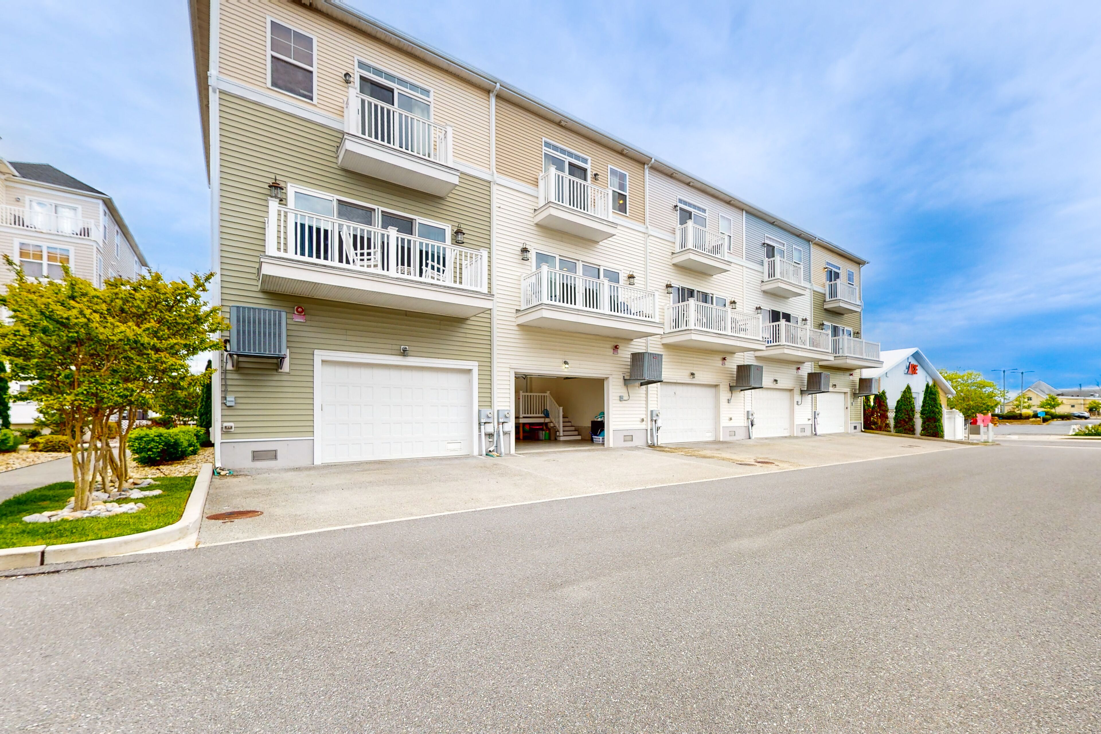 Coastal townhome near the beach with a boat slip, balcony, and pool access