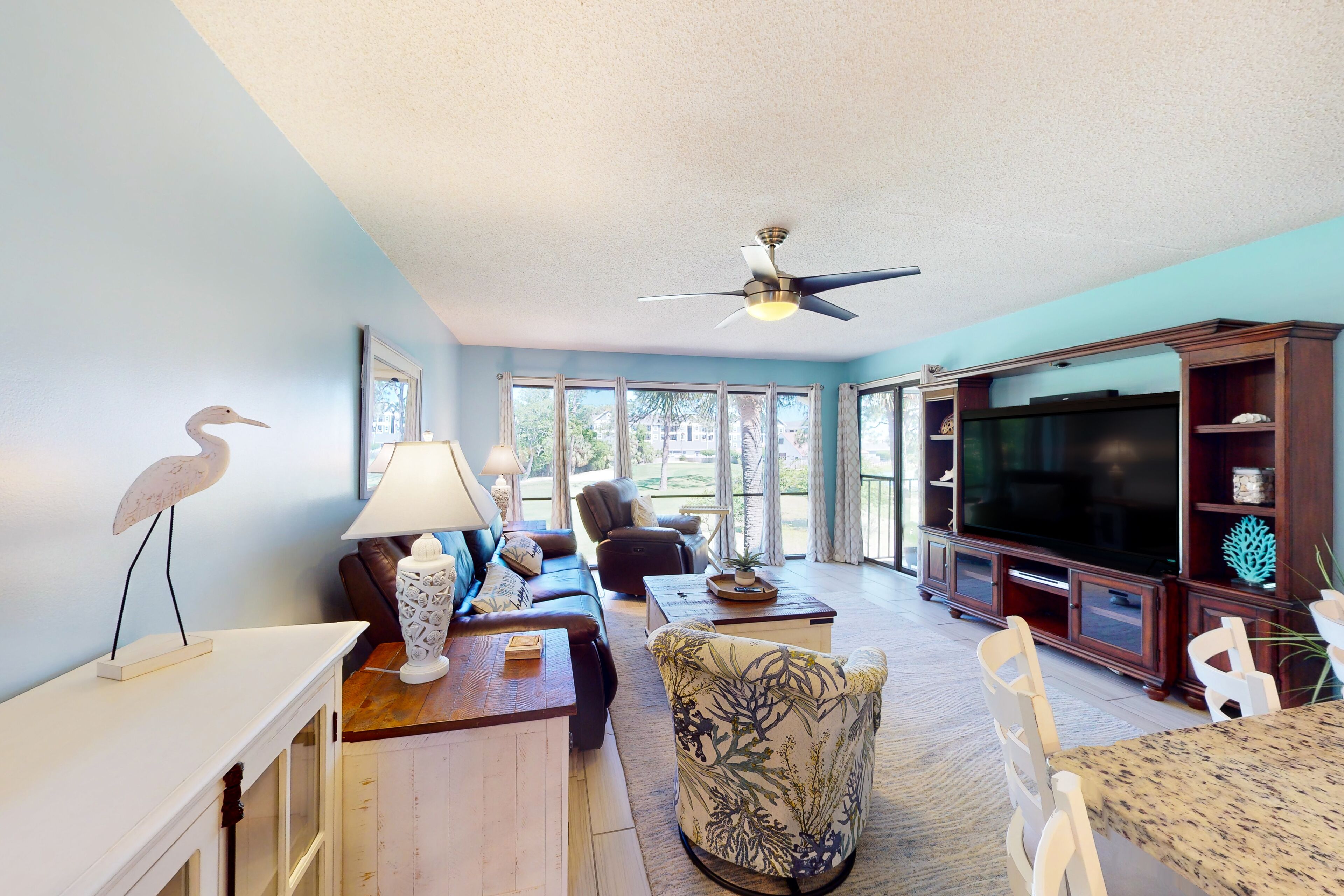 Greenside condo with on-site golf, tennis, pools, & private beach access