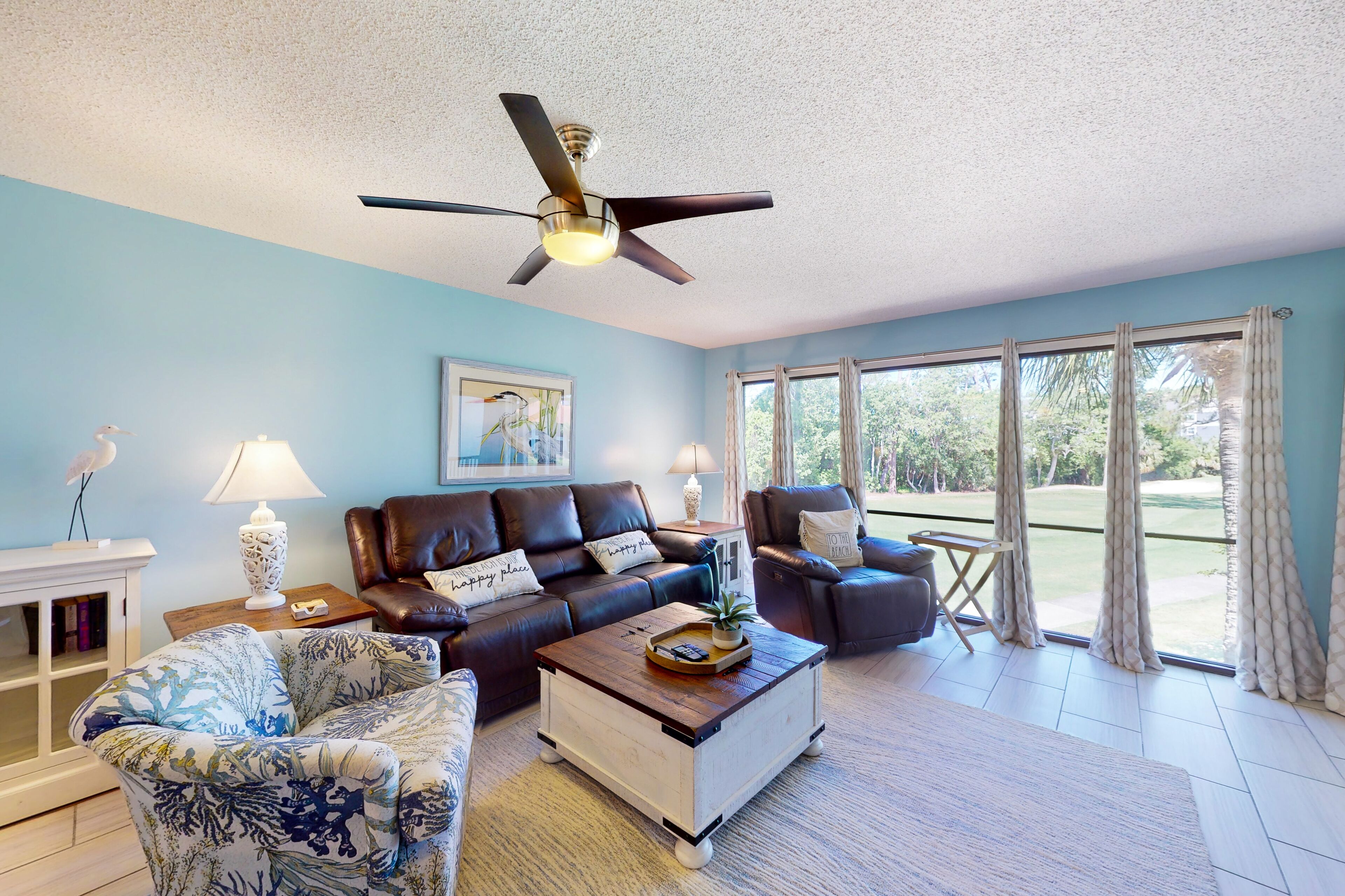 Greenside condo with on-site golf, tennis, pools, & private beach access