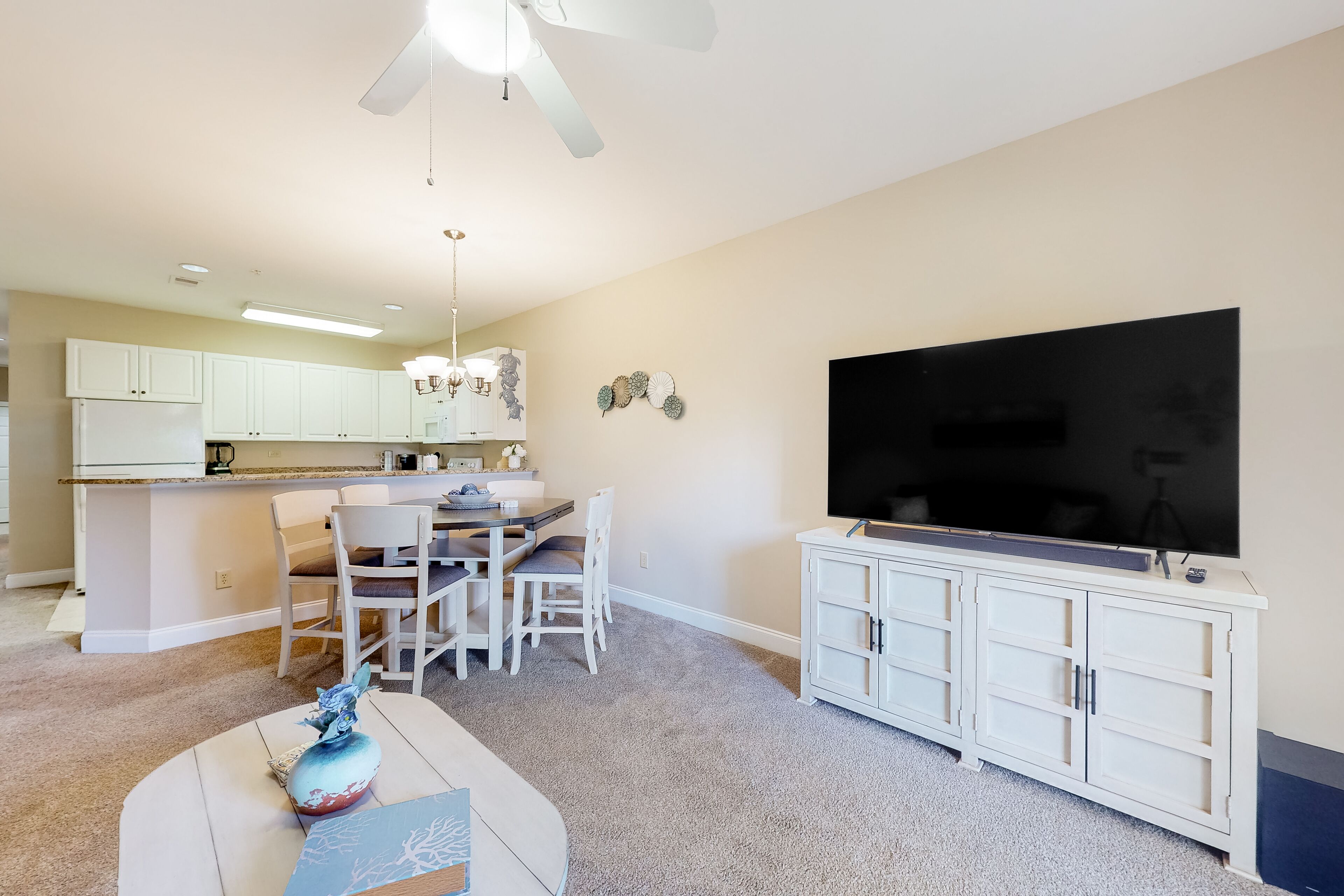 Ground-floor golf course condo with fairway views, pool access, & private patio