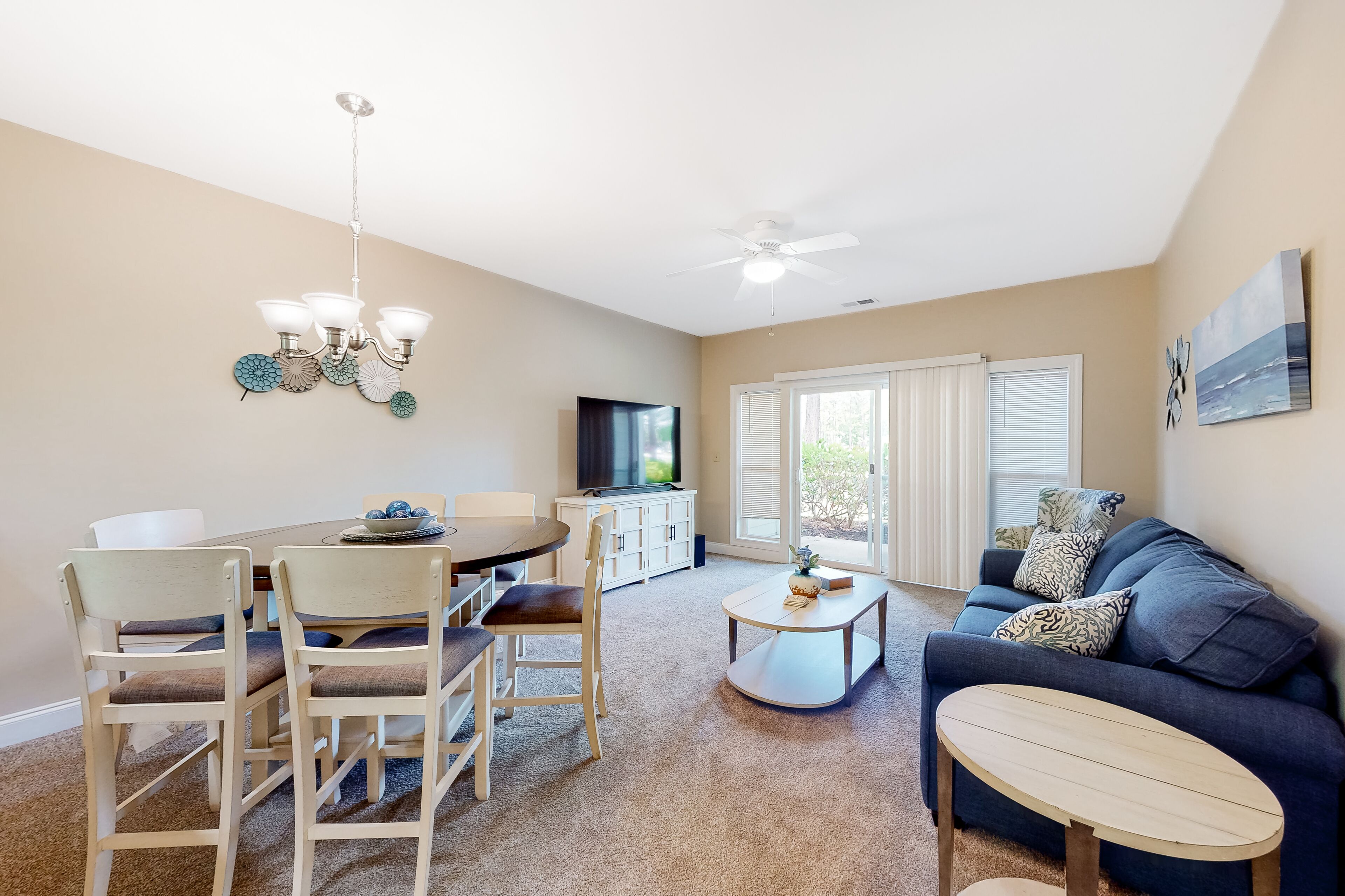 Ground-floor golf course condo with fairway views, pool access, & private patio