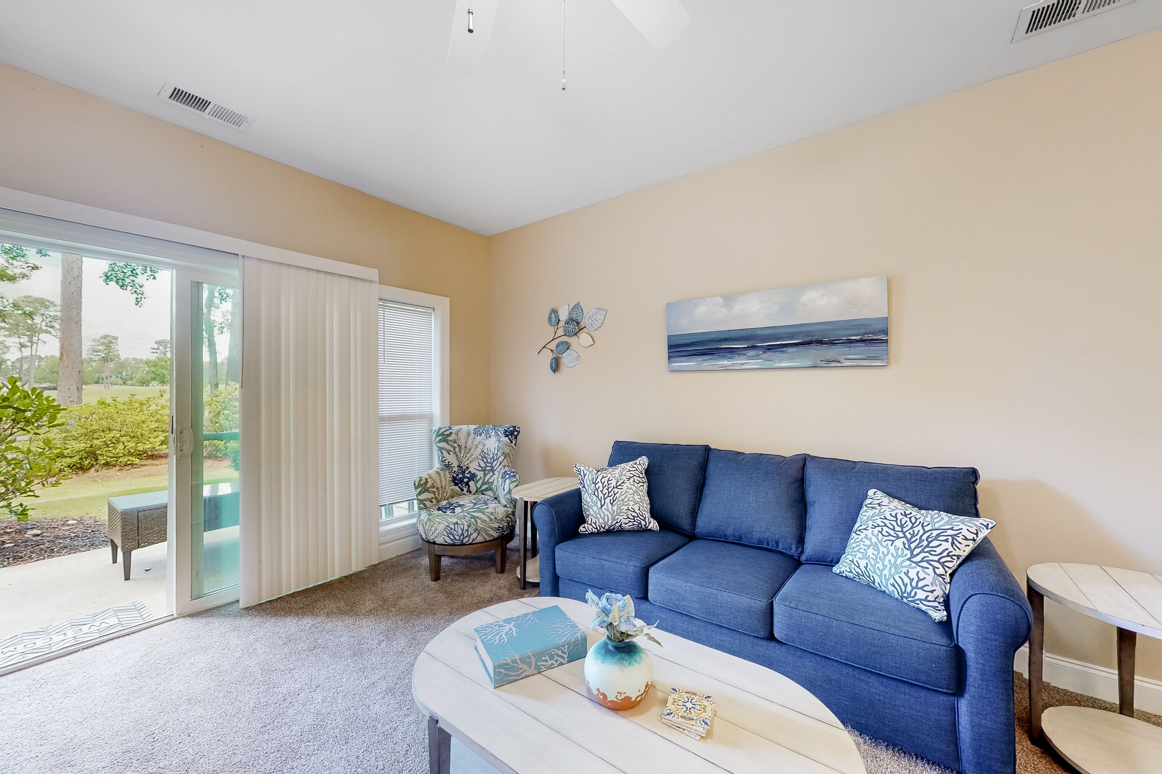 Ground-floor golf course condo with fairway views, pool access, & private patio