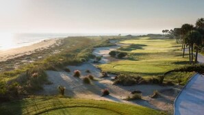 A coastal golf course with a sandy path, green fairways, and a beach in the background. - Palmetto Grove,  Walk to Shem Creek, Mins to Dwt (Mount Pleasant)