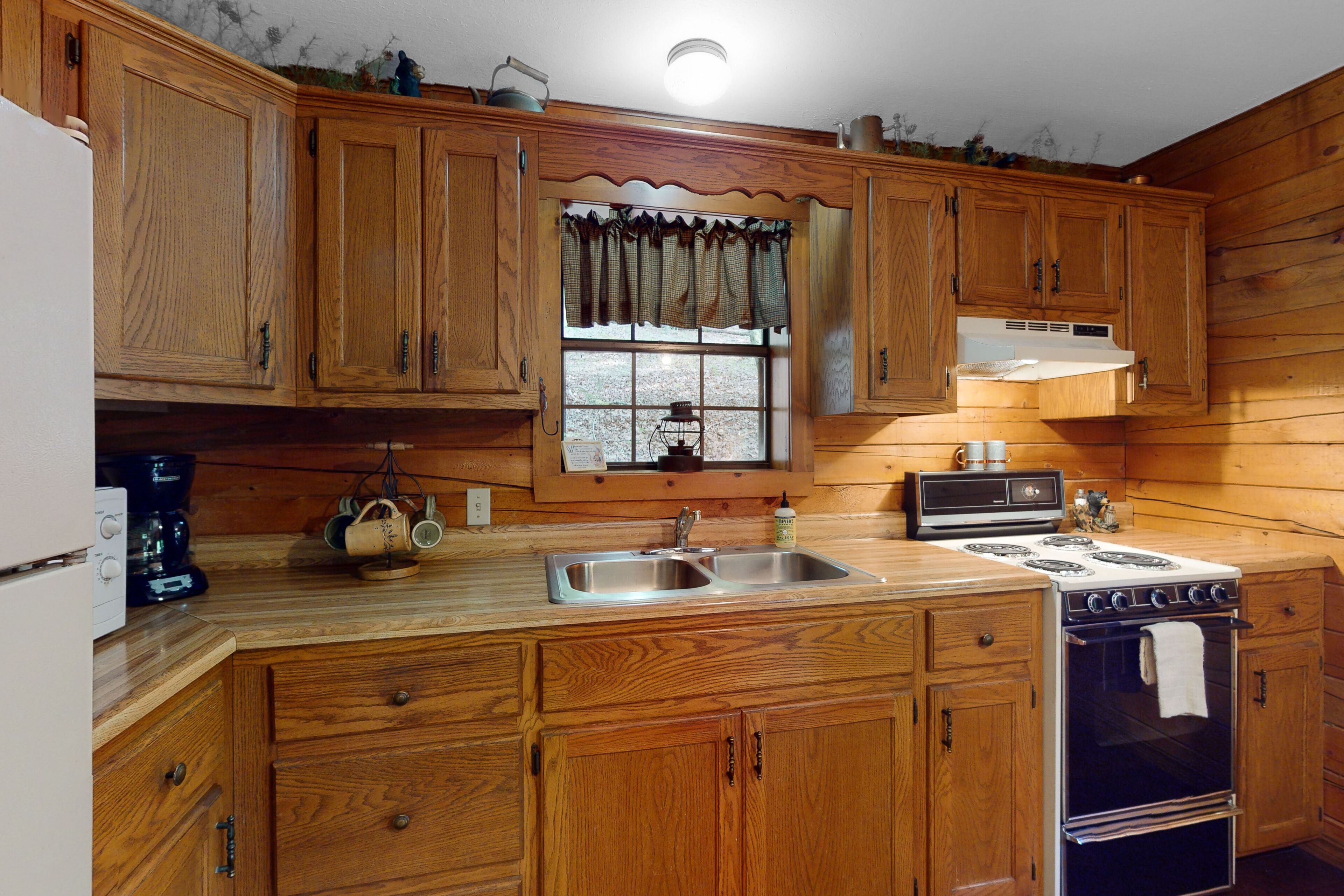 Dog-friendly cabin with private porch, fireplace, & on-site fishing pond