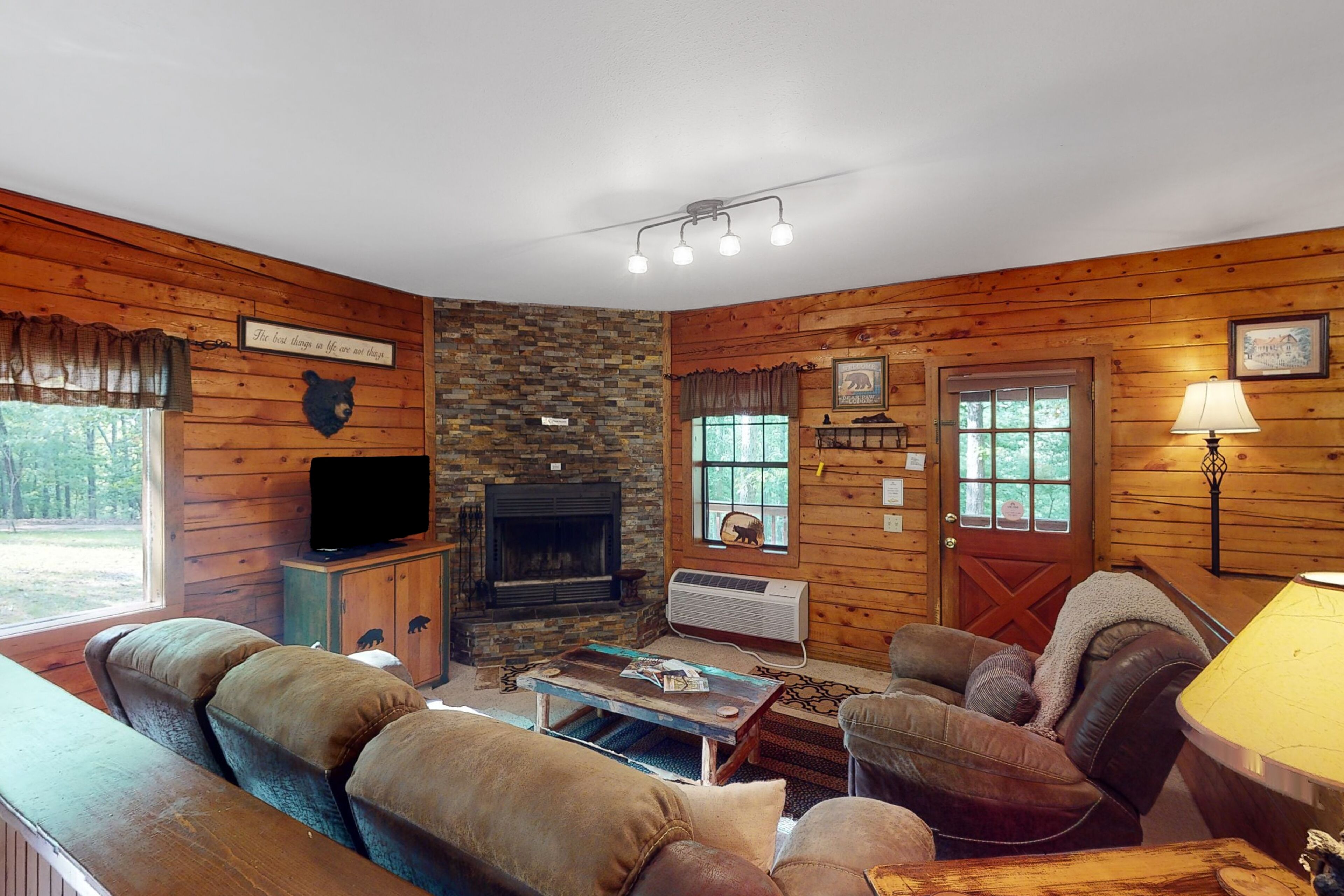 Dog-friendly cabin with private porch, fireplace, & on-site fishing pond