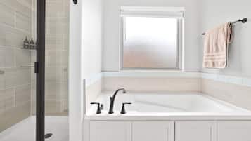 Bathtub, hair dryer, towels