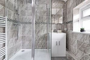 Shower, hair dryer, towels, soap