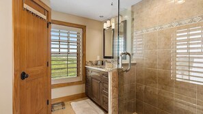 Shower, hair dryer, towels, shampoo