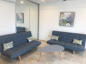 Family Suite, Balcony (2C) | Living area | 42-inch Smart TV with digital channels, TV - Kuyaan Coral Suites (Playa del Carmen)