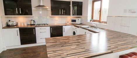 Fridge, electric kettle, toaster, cookware/dishes/utensils