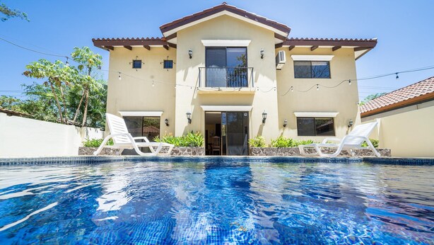 A two-story house with a swimming pool in front. - Freshly Updated 3BR With Pool Walk to the Beach Casa Luz de Luna (Tempate)