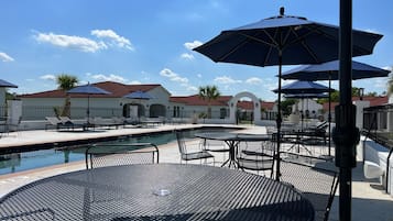 Outdoor pool, open 9:00 AM to 9:00 PM, pool umbrellas, pool loungers